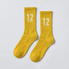 Calcetines Ayrton Senna 12, temporada 1988 amarillo, el par en plano