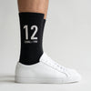 Calcetines Ayrton Senna 12, temporada 1988 negro, primer plano del motivo tejido