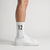 Calcetines Kimi Antonelli 12 blanco, puestos, vista de perfil con zapatillas blancas