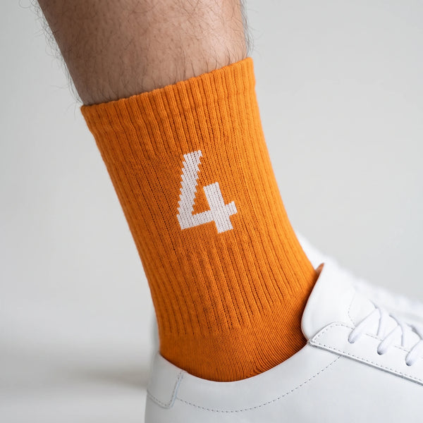 Calcetines Lando Norris 4 naranja, primer plano del motivo tejido
